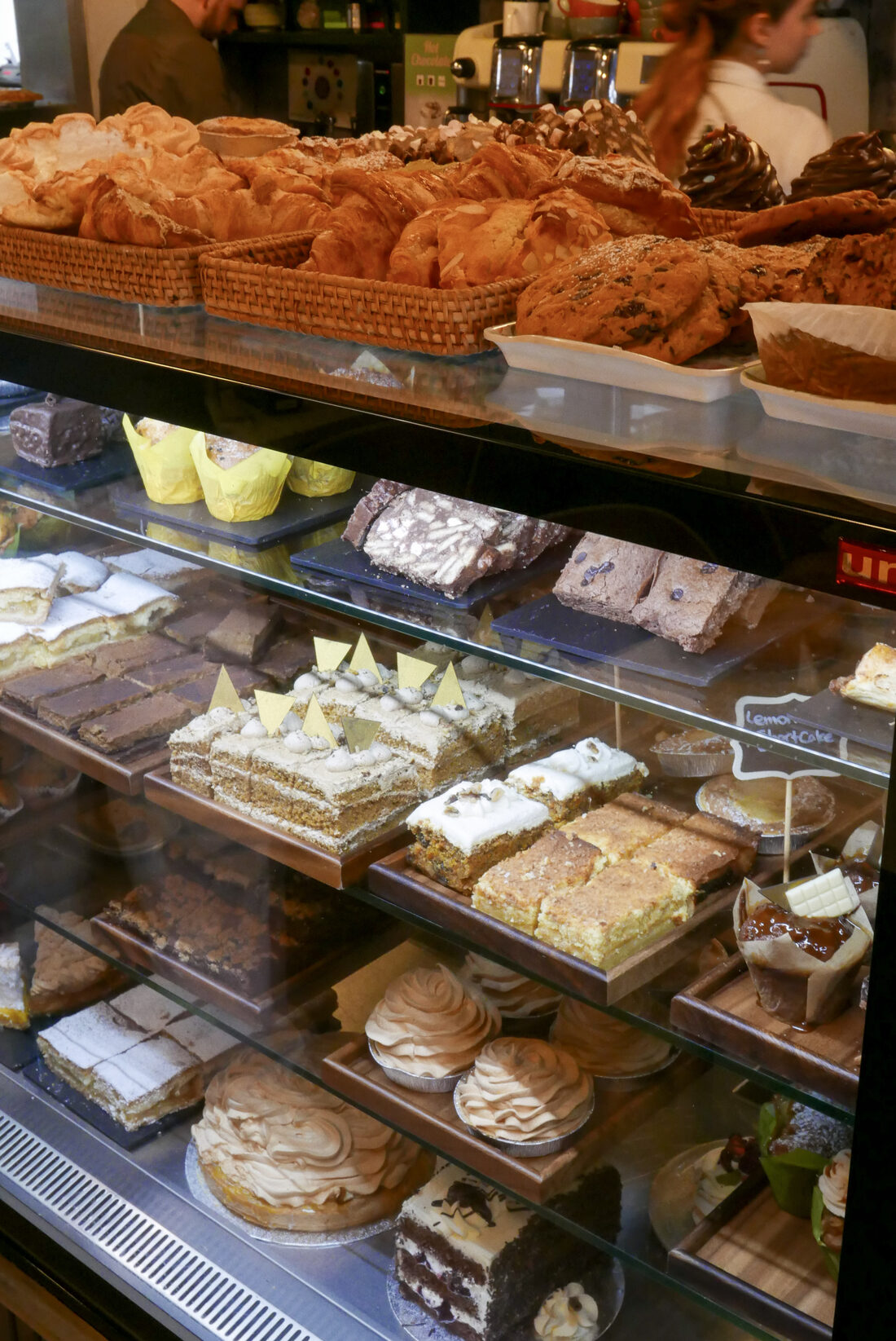 Croissants, traybakes and cakes in the bakery display at Mason's Apron