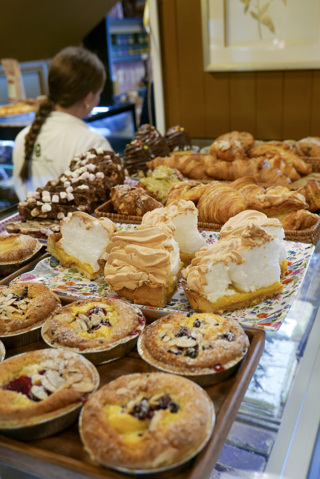 Lemon meringue slices, fruit tarts and croissants on the Mason's Apron counter